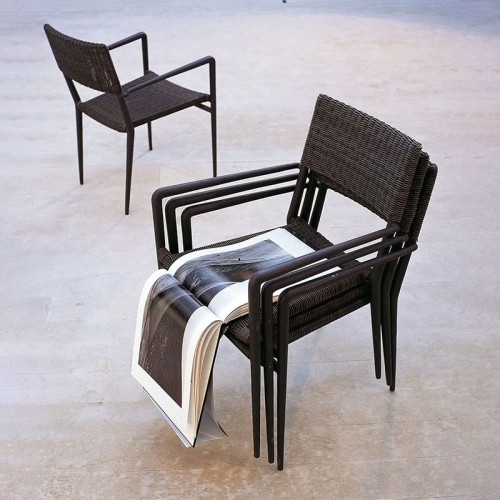 Experience stackable Unopiù Chair with armrests